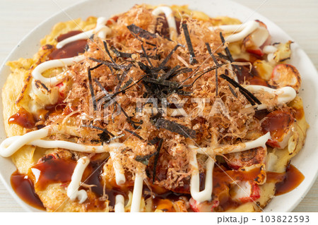 Japanese Traditional Pizza that called Okonomiyaki Japanese Traditional Pizza that called Okonomiyaki 103822593