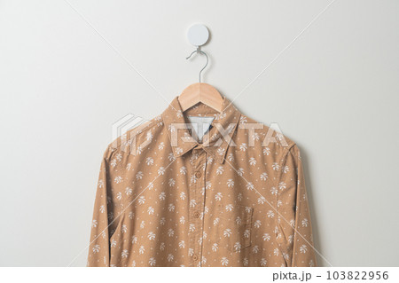 hanging shirt with wood hanger on wall hanging shirt with wood hanger on wall 103822956
