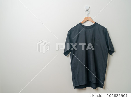hanging shirt with wood hanger on wall hanging shirt with wood hanger on wall 103822961