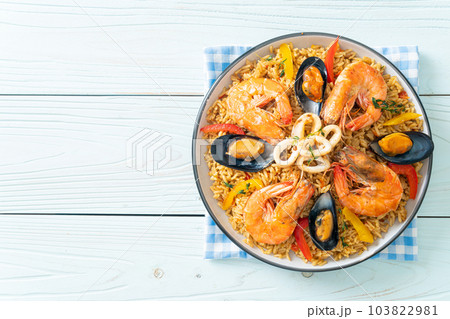 Seafood Paella with prawns, clams, mussels on saffron rice Seafood Paella with prawns, clams, mussels on saffron rice 103822981