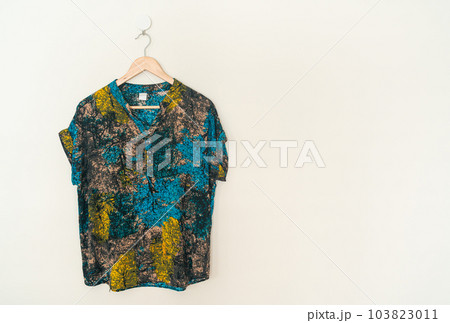 beautiful woman shirt hanging on wall 103823011