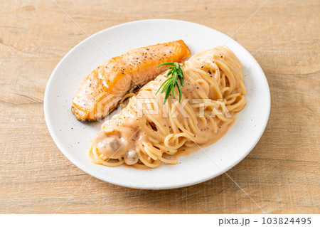 grilled salmon with spaghetti creamy tomato sauce grilled salmon with spaghetti creamy tomato sauce 103824495
