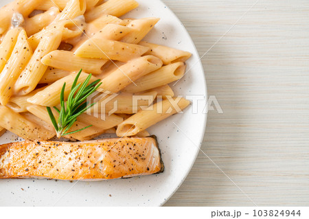 salmon with penne pasta cream sauce salmon with penne pasta cream sauce 103824944