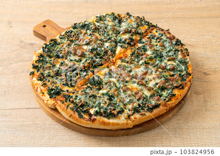 spinach and cheese pizza on wood tray spinach and cheese pizza on wood tray 103824956