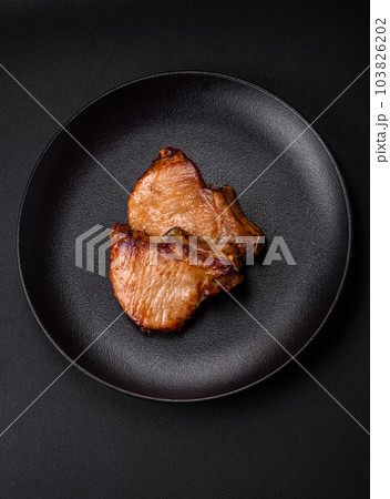 Delicious juicy pork or beef steak with salt, spices and herbs 103826202