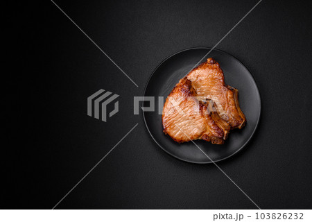 Delicious juicy pork or beef steak with salt, spices and herbs 103826232