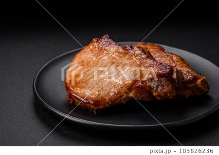 Delicious juicy pork or beef steak with salt, spices and herbs 103826236