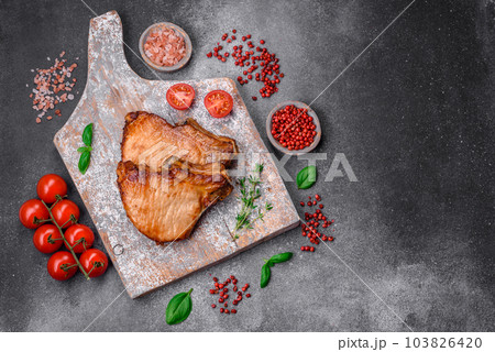 Delicious juicy pork or beef steak with salt, spices and herbs 103826420