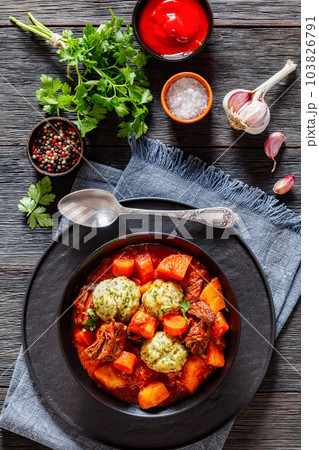 Beef Stew with Dumplings in bowl, top view Beef Stew with Dumplings in bowl, top view 103826791