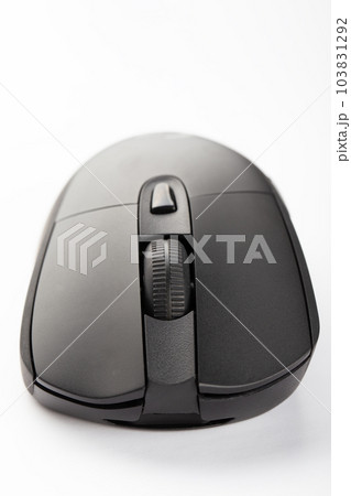 Black wireless computer mouse on a white background. Black wireless computer mouse on a white background. 103831292