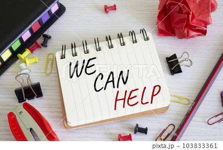 We can help symbol. Concept words We can help on white notebook. Beautiful wooden background. Business and We can help concept. Copy space. We can help symbol. Concept words We can help on white notebook. Beautiful wooden background. Business and We can help concept. Copy space. 103833361