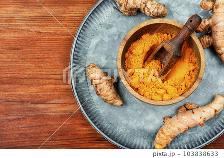 Turmeric root and curcuma powder, medicine herb. 103838633