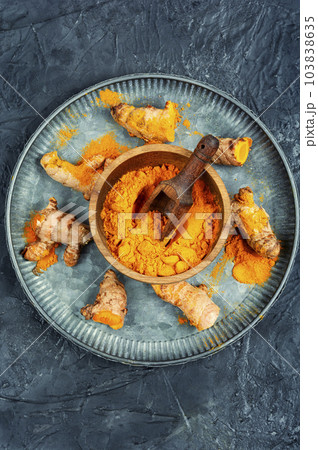 Turmeric root and turmeric powder. Turmeric root and turmeric powder. 103838635