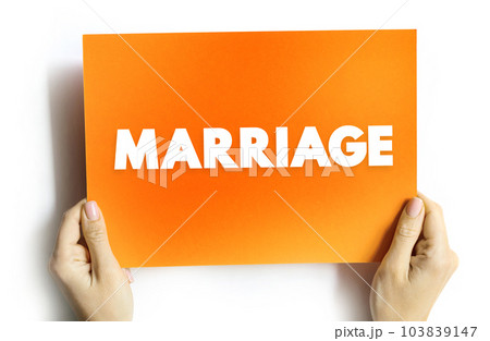 Marriage - the legally or formally recognized union of two people as partners in a personal relationship, text concept on card 103839147