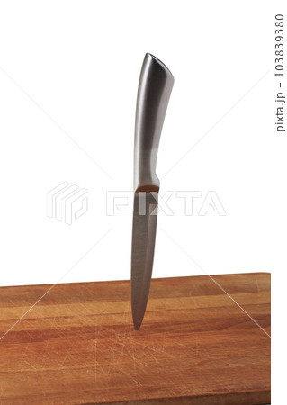 Knife stuck in cutting board Knife stuck in cutting board 103839380