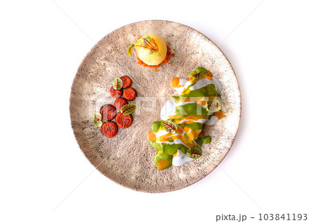 Salmon fillet in mango sauce with pineapple ice cream isolated 103841193