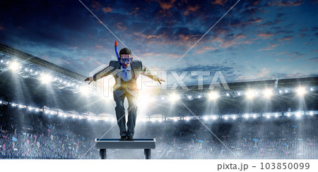 Young businessman in suit ready to dive Young businessman in suit ready to dive 103850099