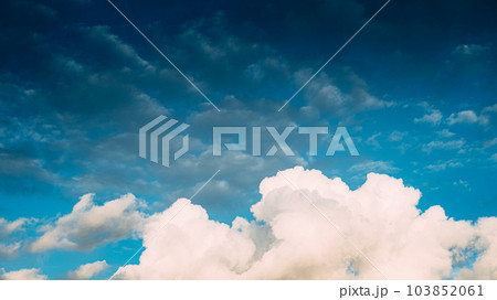 Huge white fluffys clouds sky background with blue sky background Huge white fluffys clouds sky background with blue sky background 103852061