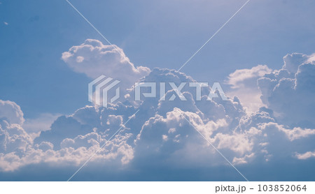 Beautiful white fluffy clouds sky background abstract season and weather. Beautiful white fluffy clouds sky background abstract season and weather. 103852064