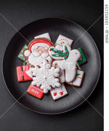 Delicious fresh colorful Christmas or New Year gingerbread cookies 103852159