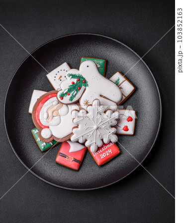 Delicious fresh colorful Christmas or New Year gingerbread cookies 103852163