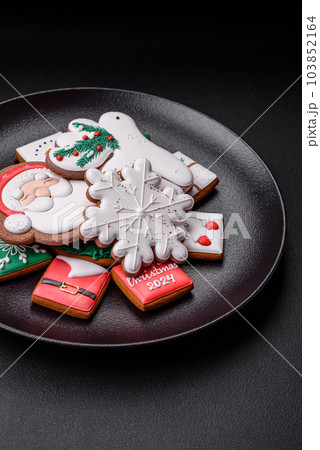 Delicious fresh colorful Christmas or New Year gingerbread cookies 103852164