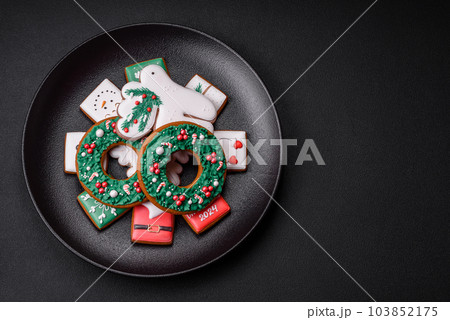 Delicious fresh colorful Christmas or New Year gingerbread cookies 103852175