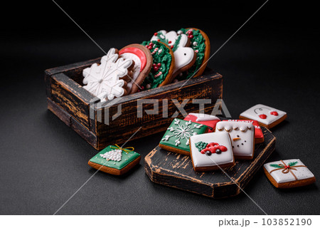 Delicious fresh colorful Christmas or New Year gingerbread cookies 103852190