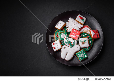 Delicious fresh colorful Christmas or New Year gingerbread cookies 103852208