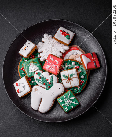 Delicious fresh colorful Christmas or New Year gingerbread cookies 103852209