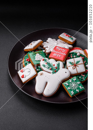 Delicious fresh colorful Christmas or New Year gingerbread cookies 103852210