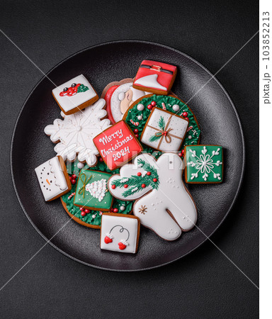 Delicious fresh colorful Christmas or New Year gingerbread cookies 103852213