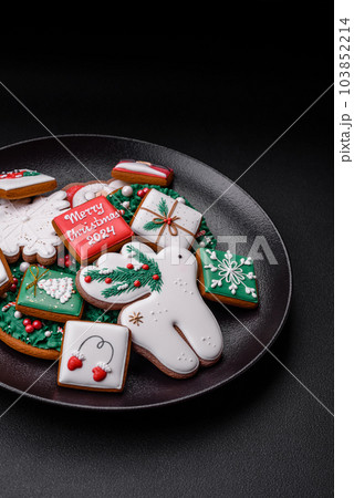 Delicious fresh colorful Christmas or New Year gingerbread cookies 103852214