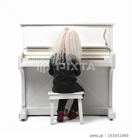 Little boy with blond hair in ancient medieval black clothes stay before the harpsichord piano, little Mozart, isolated on white 103852868