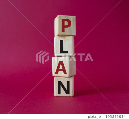 Plan symbol. Concept word Plan on wooden cubes. Beautiful red background. Business and Plan concept. Copy space. 103853054
