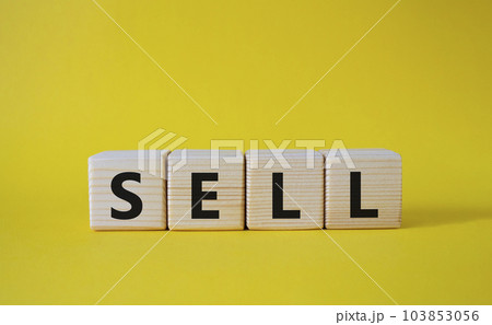 Sell symbol. Concept word Sell on wooden cubes. Beautiful yellow background. Business and Sell concept. Copy space. 103853056