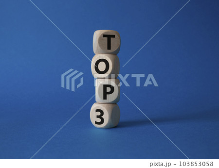 Top 3 symbol. Concept word Top 3 on wooden cubes. Beautiful blue background. Business and Top 3 concept. Copy space. 103853058