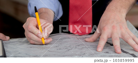 Closeup hands of team architect or engineer man meeting for planning of development real estate. 103859995