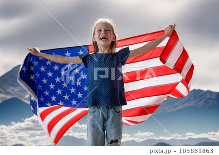 Patriotic holiday, child with American flag 103861863