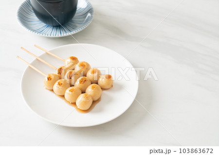 Mitarashi dango. Dumpling in a sweet soy sauce Mitarashi dango. Dumpling in a sweet soy sauce 103863672