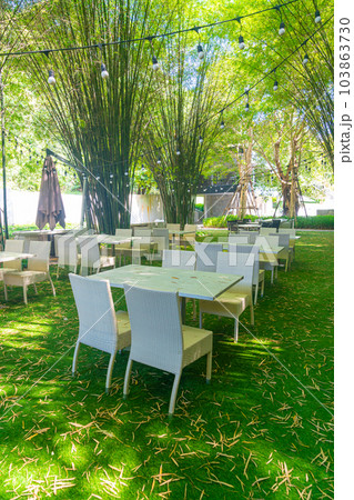 empty wicker table and chair in outdoor restaurant 103863730