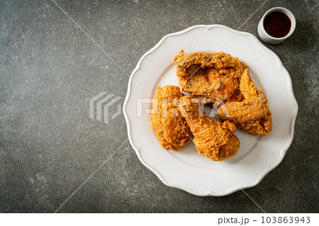 fried chicken with ketchup on plate fried chicken with ketchup on plate 103863943