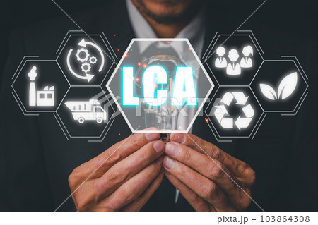 LCA, Life cycle assessment concept, Business person hand holding light bulb with Life cycle assessment icon on virtual screen. 103864308