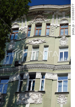 Kiev, Ukraine July 10, 2021: The ornate facade of an ancient building in the center of Kiev Kiev, Ukraine July 10, 2021: The ornate facade of an ancient building in the center of Kiev 103866077