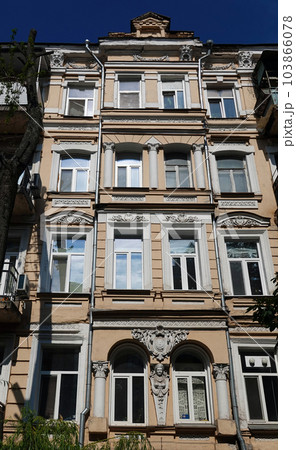 Kiev, Ukraine July 10, 2021: The ornate facade of an ancient building in the center of Kiev Kiev, Ukraine July 10, 2021: The ornate facade of an ancient building in the center of Kiev 103866078