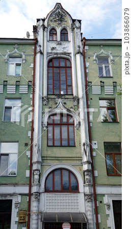 Kiev, Ukraine July 10, 2021: The ornate facade of an ancient building in the center of Kiev Kiev, Ukraine July 10, 2021: The ornate facade of an ancient building in the center of Kiev 103866079