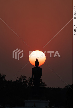Head of statue of Buddha image surrounded by sun. Head of statue of Buddha image surrounded by sun. 103866339