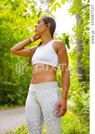 Fit Woman Taking a Break from Exercising Outdoors 103867107