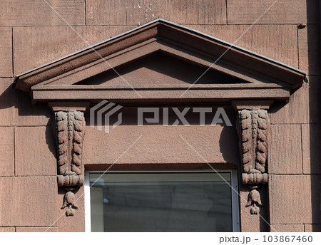 Kiev, Ukraine June 10, 2021: Elements of artistic decoration of the facade of a building in the city of Kiev Kiev, Ukraine June 10, 2021: Elements of artistic decoration of the facade of a building in the city of Kiev 103867460
