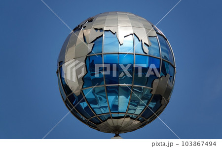 Kiev, Ukraine November 28, 2020: Globe on the building of the Ministry of Infrastructure of Ukraine in the center of Kiev Kiev, Ukraine November 28, 2020: Globe on the building of the Ministry of Infrastructure of Ukraine in the center of Kiev 103867494
